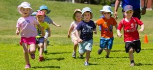 kids running in preschool sports outdoor program