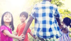kids and adult playing outside