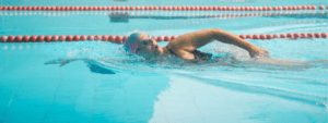 adult swimming in the pool