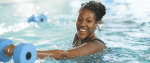 woman enjoying a class in the pool
